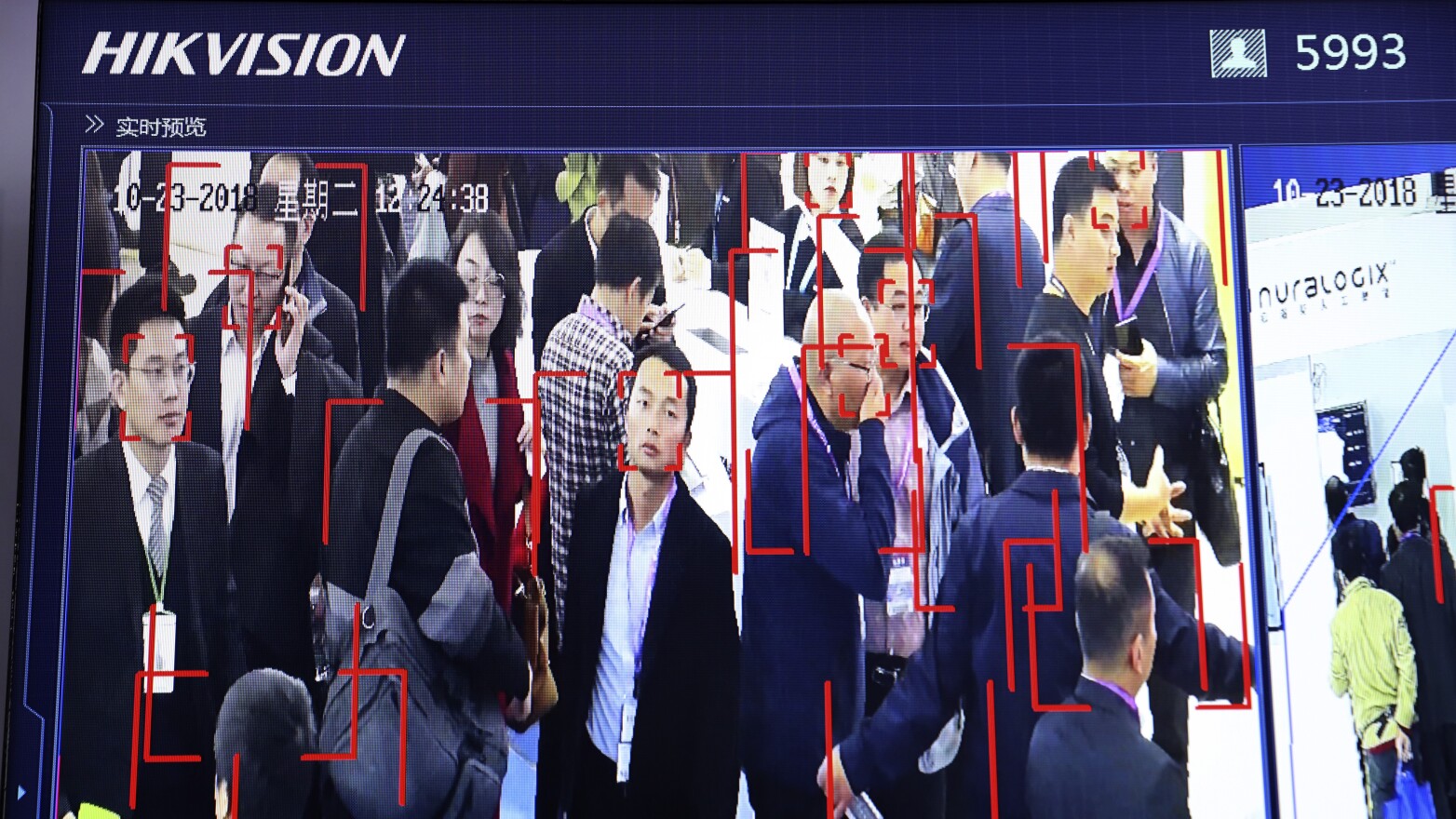 Visitors are tracked by face recognition technology from state-owned surveillance equipment manufacturer Hikvision at the Security China 2018 expo in Beijing. Hikvision is one of several firms that have been added to a U.S. trade blacklist.